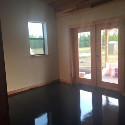Sheet rock with poplar ceilings and stained concrete floors